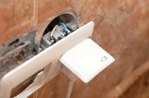 Dangerous broken electrical socket. Broken outlet. Stock Photos