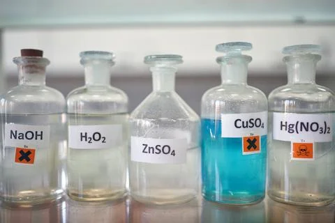 Dangerous chemicals on the shelf in the laboratory. Chemistry, lab, chemicals Stock Photos