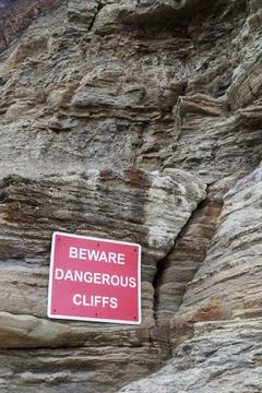 Dangerous cliffs warning sign Stock Photos