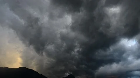 Dangerous clouds on the sky. Thunderstorm over the mountain. Swiss Alps. Uri. Stock Footage 65210672