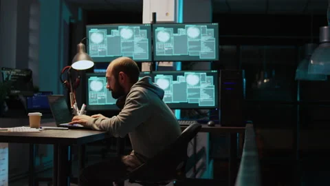 Dangerous coder feeling happy about hacking security system 動画素材 229335538