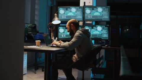 Dangerous coder feeling happy about hacking security system Stock Photos