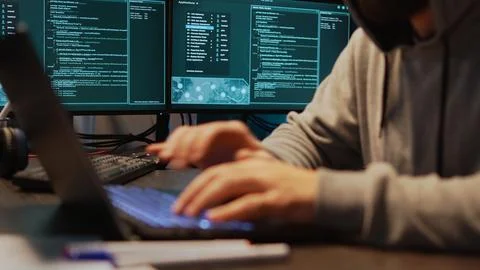 Dangerous coder hacking security system to steal big data Stock Photos