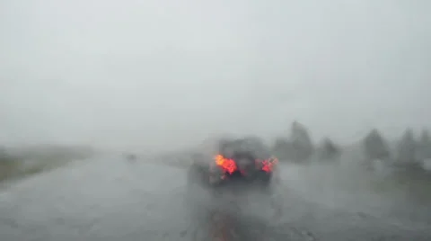 Dangerous drive condition on road. Overtake car in terrible rain Video stock 33072008