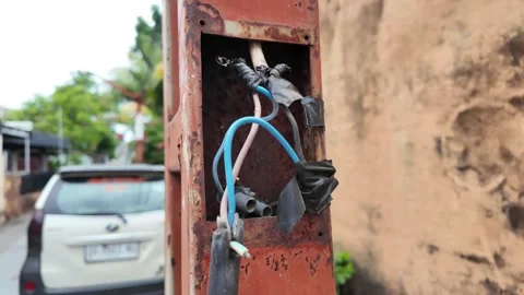 Dangerous exposed electrical wires in rusty pole Stock Footage 335190861
