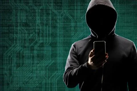 Dangerous hacker with a smartphone gadget over digital background with binary 写真素材