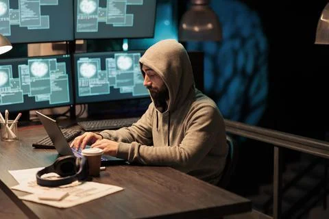Dangerous hacker working on security breach Stock Photos