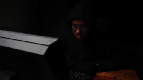 Dangerous Hooded Hacker Breaks into  Data Servers 動画素材 220072546