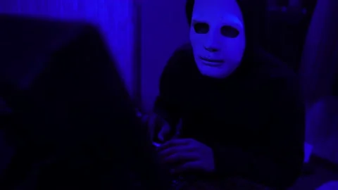 Dangerous Hooded Hacker Breaks into  Data Servers Stock-Footage 220073847