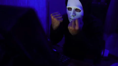Dangerous Hooded Hacker Breaks into  Data Servers 動画素材 220073989