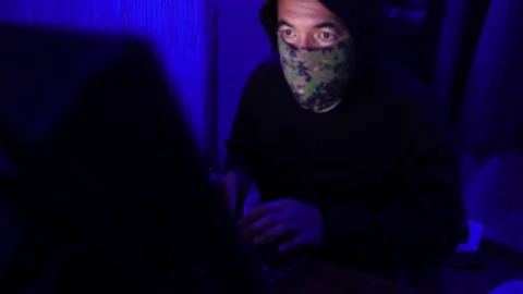 Dangerous Hooded Hacker Breaks into  Data Servers Stock Footage 220074074