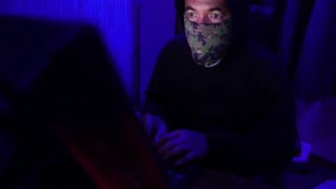 Dangerous Hooded Hacker Breaks into  Data Servers Stock Footage 220074107