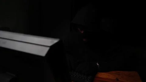 Dangerous Hooded Hacker Breaks into  Data Servers Stock Footage 220074375