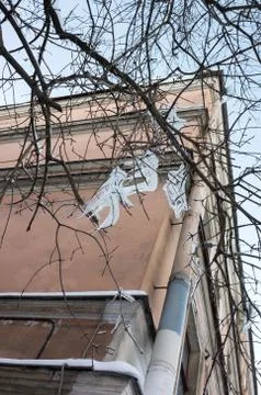 Dangerous icicles are on bare tree branches Stock Photos
