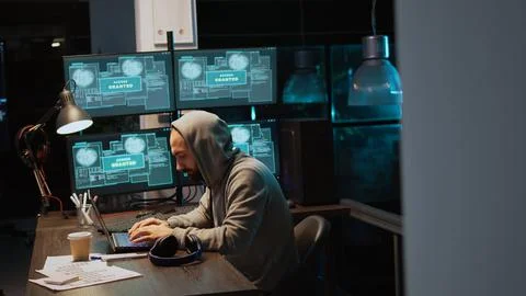 Dangerous IT coder working on security breach Stock Photos