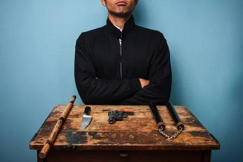 Dangerous man with various weapons Photos