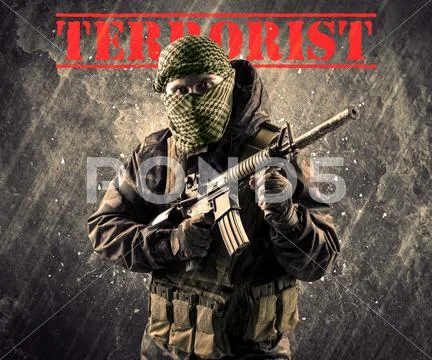Dangerous masked and armed man with terrorist sign on grungy background Stock Photos