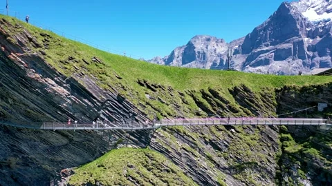 Dangerous mountain Hanging Bridge on a cliff Stock Footage 246984034