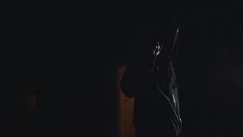 Dangerous people in balaclava masks with guns at night entering the prohibited Stock Footage