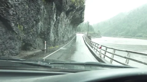 Dangerous road cutting in mountain by river Stock-Footage 160648239