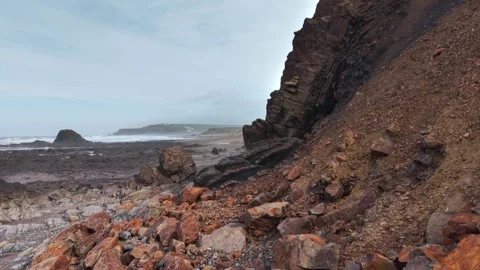 Dangerous rockfall on Cornwall beach Stock Footage 329433719
