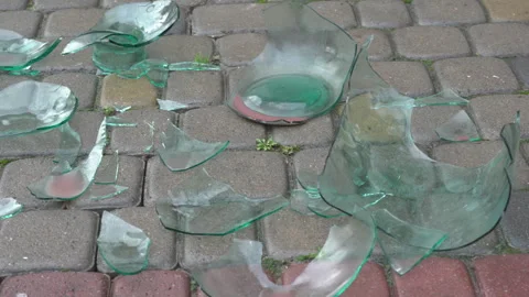 Dangerous sharp glass splinters on the pedestrian walkway Vidéo 328489252