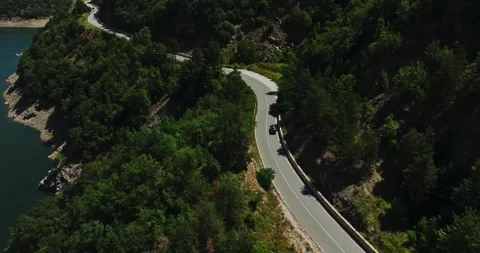 Dangerous Vibrant Mountain Road Precise Fpv Drone Car Follow Scene Summer Heat Stock Footage 289417700