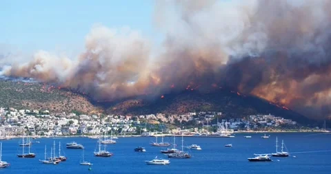 Dangerous wildfire approaching the harbor of Bodrum travel destination Stock Footage