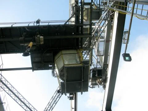 Dangerous workplace in height, crane operator cabin, steel working platforms Stock Photos