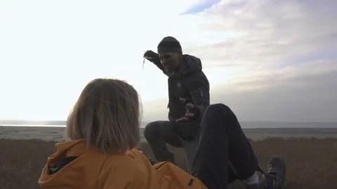 Dangerous zombie monster with Machete attacking blonde girl in Wasteland. Horror Stock Footage 103386695