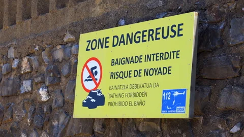 Dangerous Zone and Bathing Forbidden safety sign in Biarritz France Stock Footage 340606786
