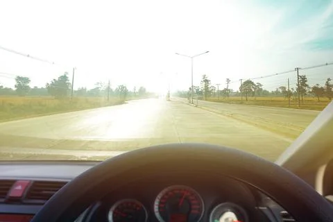 Dangers while driving on the road When there is light reflecting the sun on t Stock Photos