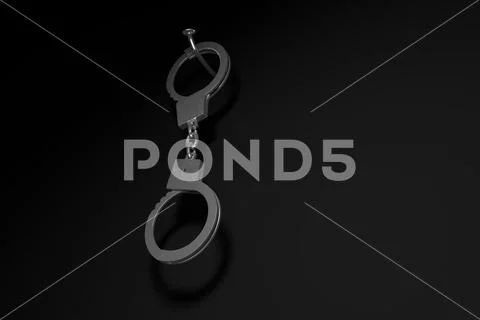 Dangling handcuffs on a nail. Stock Illustration