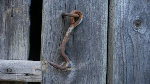 Dangling hook of wooden door. Loop 2 Video stock 130663949