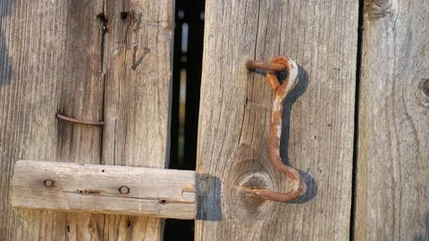 Dangling hook of wooden door. Shadow of a man Stock-Footage 130663764
