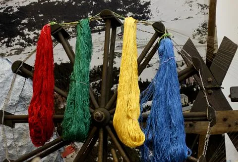 Dangling yarns for drying from spinning wheels to beautiful colors of red and Stock Photos