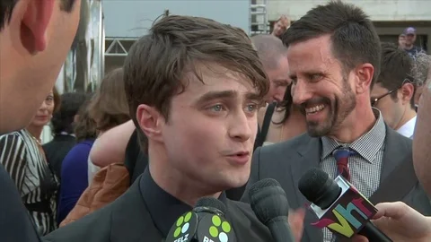 Daniel Radcliffe is interviewed on the red carpet for Harry Potter premiere Stock Footage 73512751