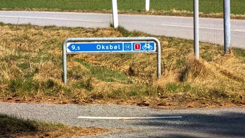 Danish cycle path sign pointing to Oksbol Video stock 339438733