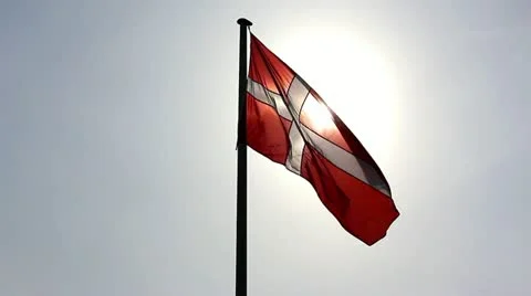 Danish flag against the sun Stock Footage 22322492