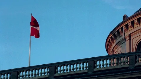 The Danish flag on the building of the old opera house Stock Footage 129836670
