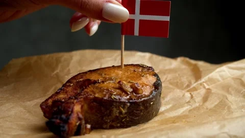 Danish flag on grilled fish, symbol of North Sea and Baltic fish from Danish Stock Footage 323012827
