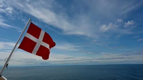 Danish flag waving on a boat while sailing in the ocean under a clear sky d.. Stock Footage 340201761