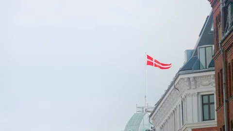 Danish flag waving in the wind on top of a building Stock Footage 91011313