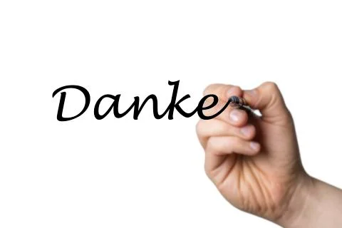 Danke written by a hand Stock Photos