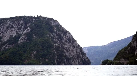 Danube Boilers where the river pierce large stone mountains covered by dense Stock Footage 59841132