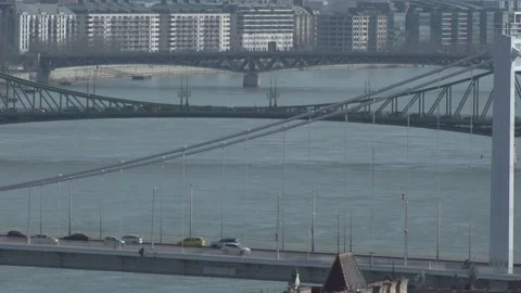 Danube River Bridges and Modern Budapest Waterfront Telephoto View Stock Footage 336066337