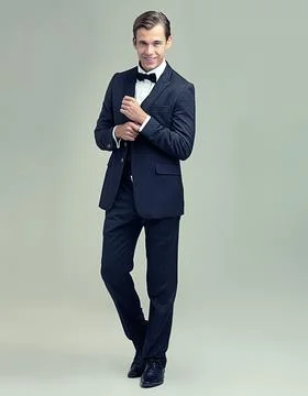 A dapper gentleman. A full length studio portrait of a stylish young gentleman Stock Photos