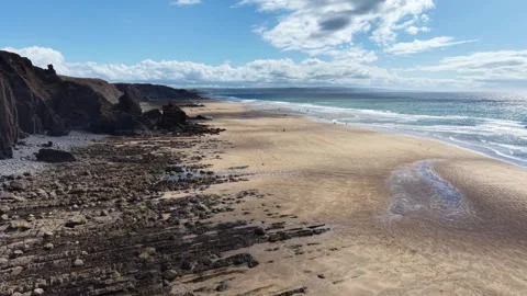 Dappled light on the summertime beach at Sandymouth Bay Cornwall Stock Footage 341462434