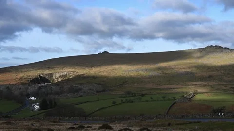 Dappled winter sunlight over road past Merrivale Dartmoor Stock Footage 300989758