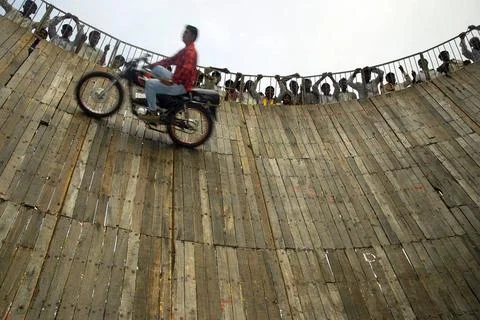 Dare devil performer performing on well of death at annual Pandharpur fair... Stock Photos
